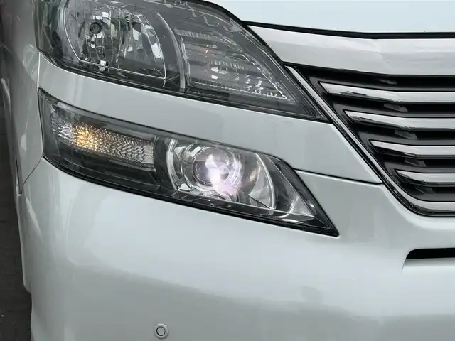 トヨタ ヴェルファイア 2．4Z プラチナセレクションⅡ 静岡県 2010(平22)年 9.4万km ホワイトパールクリスタルシャイン ワンオーナー/社外HDDナビ（VIE-X088）/フルセグTV/DVD/CD/USB/SD/社外フリップダウンモニター/バックカメラ/両側パワースライド/パワーバックドア/純正18インチアルミホイール/ウッドコンビハンドル/HIDライト/ビルトインETC/スマートキー2個/プッシュスタート/新車時保証書