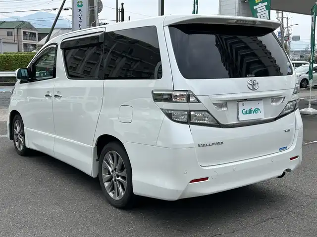 トヨタ ヴェルファイア 2．4Z プラチナセレクションⅡ 静岡県 2010(平22)年 9.4万km ホワイトパールクリスタルシャイン ワンオーナー/社外HDDナビ（VIE-X088）/フルセグTV/DVD/CD/USB/SD/社外フリップダウンモニター/バックカメラ/両側パワースライド/パワーバックドア/純正18インチアルミホイール/ウッドコンビハンドル/HIDライト/ビルトインETC/スマートキー2個/プッシュスタート/新車時保証書