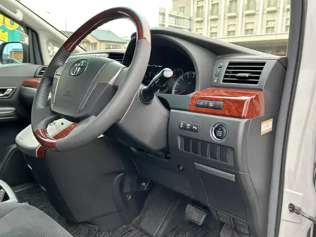 トヨタ ヴェルファイア 2．4Z プラチナセレクションⅡ 静岡県 2010(平22)年 9.4万km ホワイトパールクリスタルシャイン ワンオーナー/社外HDDナビ（VIE-X088）/フルセグTV/DVD/CD/USB/SD/社外フリップダウンモニター/バックカメラ/両側パワースライド/パワーバックドア/純正18インチアルミホイール/ウッドコンビハンドル/HIDライト/ビルトインETC/スマートキー2個/プッシュスタート/新車時保証書