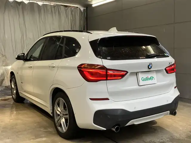 ＢＭＷ Ｘ１ xDrive 20i Mスポーツ 東京都 2018(平30)年 1.9万km アルピンホワイトⅢ ワンオーナー /ドライビングアシスト/・レーンディパーチャーニング・/・前車接近警告機能/・衝突回避・被害軽減ブレーキ/純正ナビゲーション/Bカメラ/ドライブレコーダー/ETC/スマートキー/純正ルーフレール/純正アルミホイール/パワーバックドア/スポーツモード搭載/ISOFIX/点検整備記録簿H30R123456年