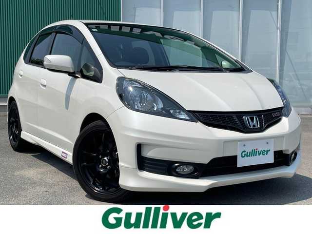ホンダ フィット RS 福岡県 2011(平23)年 7.7万km プレミアムホワイトパール Honda HDDインターナビ/スロットルコントローラー/リモコンキー/横滑り防止装置/革巻きステアリング/HIDヘッドライト/オートライト/電動格納ミラー/ウインカーミラー/フォグランプ/社外17インチAW/ETC