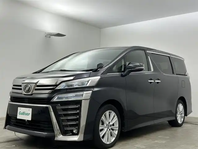 トヨタ ヴェルファイア Z 岡山県 2019(令1)年 4.8万km スパークリングブラックパールクリスタルシャイン 純正９インチナビ/【Bluetooth/フルセグTV】/１２，１インチフリップダウンモニター（V12T-R68C)/デジタルインナーミラー/追従型クルーズコントロール/純正ドライブレコーダー（前）/皮調シートカバー/オットマン/純正１８インチAW/衝突軽減ブレーキシステム/踏み間違い防止/バックカメラ/フロントカメラ/オートハイビーム/ＬＥＤヘッドライト/ビルトインＥＴＣ/両側電動スライドドア/ブラインドスポットモニター/ステアリングスイッチ/チルトステアリング/シートリフター/保証書/取扱説明書/ナビ取扱説明書/スマートキー×2
