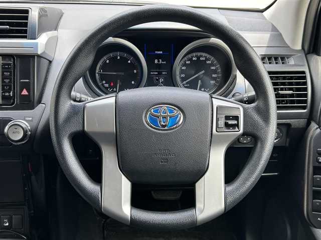 トヨタ ランドクルーザー プラド TX 福岡県 2015(平27)年 4.6万km ホワイトパールクリスタルシャイン ALPINEナビ（Bluetooth・フルセグTV）/ECLIPSE後席用モニター/リフトアップ/ドライブレコーダー（前後）/MKWアルミホイール/ルーフレール/ダウンヒルアシストコントロール/エアバッグ（運転席・助手席・サイド）/カーテンエアバッグ/ETC/スペアタイヤ/電格ミラー/純正フロアマット/布系シート/横滑り防止装置/パワーステアリング/パワーウィンドウ/スマートキー/バックカメラ/ABS/プッシュスタート/保証書/取扱説明書