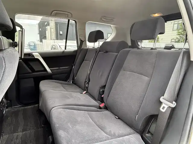 トヨタ ランドクルーザー プラド TX 福岡県 2015(平27)年 4.6万km ホワイトパールクリスタルシャイン ALPINEナビ（Bluetooth・フルセグTV）/ECLIPSE後席用モニター/リフトアップ/ドライブレコーダー（前後）/MKWアルミホイール/ルーフレール/ダウンヒルアシストコントロール/エアバッグ（運転席・助手席・サイド）/カーテンエアバッグ/ETC/スペアタイヤ/電格ミラー/純正フロアマット/布系シート/横滑り防止装置/パワーステアリング/パワーウィンドウ/スマートキー/バックカメラ/ABS/プッシュスタート/保証書/取扱説明書