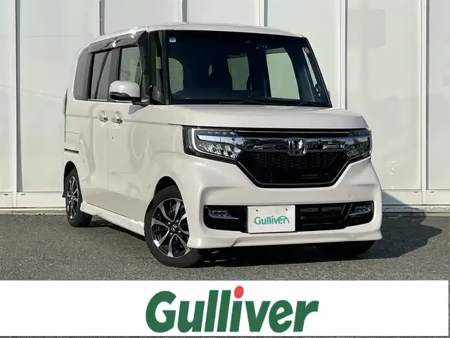 ホンダ Ｎ ＢＯＸ カスタム G L ホンダセンシング 福岡県 2020(令2)年 8.5万km プラチナホワイトパール 純正8インチナビ/（Bカメラ、TV、DVD、CD、Bluetooth、AM、FM、USB）/両側パワースライドドア/シートヒーター/レーダークルーズコントロール/ドラレコ前後/ETC/サンシェード/純正14インチホイール/プリクラッシュ/車線逸脱警報/横滑り防止装置/アイドリングストップ/純正マット/ドアバイザー/プッシュスタート/スマートキー/ステアリングボタン/ワンオーナー/保証書/取扱説明書