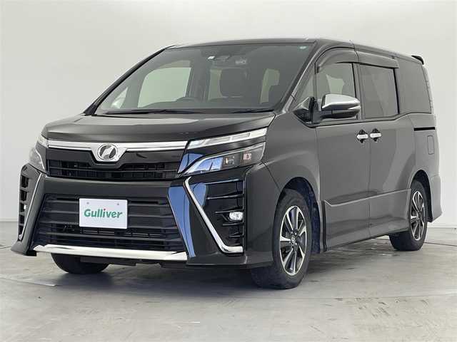 トヨタ ヴォクシー ZS 煌 福岡県 2019(平31)年 8.6万km ブラック 純正9インチナビ(NSZT-Y68T)/AM/FM/CD/DVD/BT/フルセグ/純正12インチフリップダウンモニター/ビルトインETC/バックカメラ/社外前後ドラレコ(CSD-790FHG)/トヨタセーフティセンス/プリクラッシュセーフティ/レーンディパーチャーアラート/オートマチックハイビーム/クルーズコントロール/両側パワースライドドア/ステアリングスイッチ/LEDヘッドライト/スマートキー/プッシュスタート