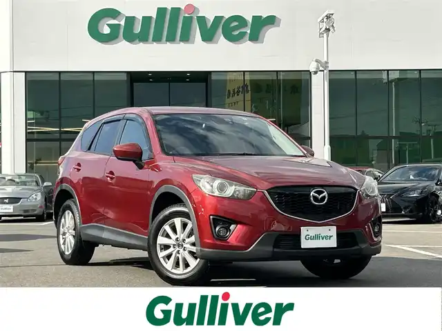 マツダ ＣＸ－５ XD 滋賀県 2012(平24)年 8.6万km ジールレッドマイカ 登録時走行距離：85529Km/ディーラーOP社外SDナビ/フルセグTV/Bluetooth/CD/DVD/SD/クルコン/アイドリングストップ/ETC/スマートキー/横滑り防止装置/盗難防止装置/衝突軽減システム/サイドブラインドモニター/キセノンヘッドライト/オートライト/ハロゲンフォグランプ/エンジンスタートボタン/スマートキー/純正アルミホイール/純正フロアマット