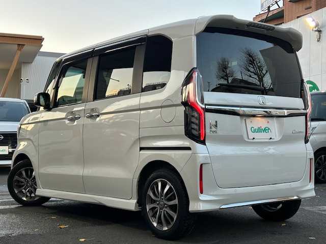 ホンダ Ｎ ＢＯＸ カスタム L 東京都 2022(令4)年 0.9万km プラチナホワイトパール ホンダセンシング/社外SDナビTV/パワースライドドア（助手席）/シートヒーター（前席）/LEDヘッドランプ/オートライト/ウレタン製ステアリングホイール/ステアリングスイッチ/ドライブレコーダー（前後）/衝突軽減ブレーキ/誤発信抑制機能/後方誤発信抑制機能/歩行者事故低減ステアリング/アダクティブクルーズコントロール/オートハイビーム/標識認識機能/路外逸脱抑制機能/ETC/ハーフシェイドフロントウィンドウ/ロールサンシェイド（後席左右）/ベンチシート（後席）/ISOFIX（後席）/チップアップシート/プラズマクラスター付オートエアコン/ドアバイザー/プッシュスタート/電動格納ドアミラー/スペアキー/保証書＆取扱説明書