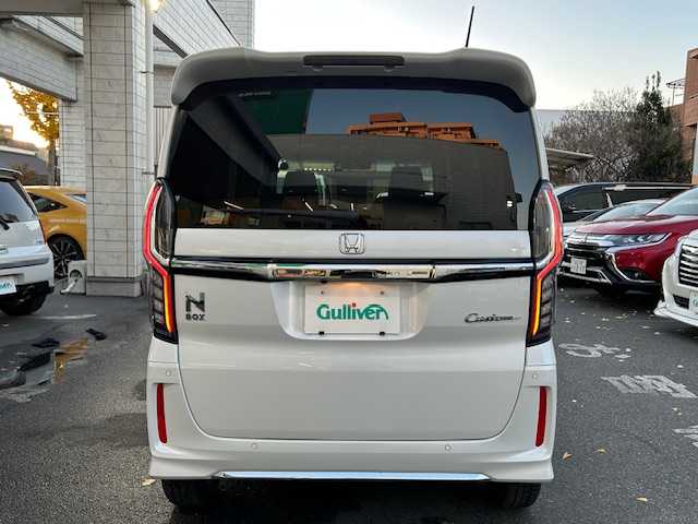 ホンダ Ｎ ＢＯＸ カスタム L 東京都 2022(令4)年 0.9万km プラチナホワイトパール ホンダセンシング/社外SDナビTV/パワースライドドア（助手席）/シートヒーター（前席）/LEDヘッドランプ/オートライト/ウレタン製ステアリングホイール/ステアリングスイッチ/ドライブレコーダー（前後）/衝突軽減ブレーキ/誤発信抑制機能/後方誤発信抑制機能/歩行者事故低減ステアリング/アダクティブクルーズコントロール/オートハイビーム/標識認識機能/路外逸脱抑制機能/ETC/ハーフシェイドフロントウィンドウ/ロールサンシェイド（後席左右）/ベンチシート（後席）/ISOFIX（後席）/チップアップシート/プラズマクラスター付オートエアコン/ドアバイザー/プッシュスタート/電動格納ドアミラー/スペアキー/保証書＆取扱説明書