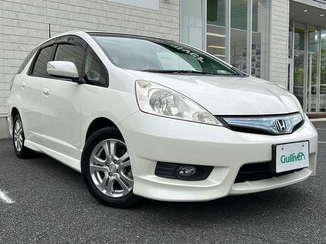 ホンダ フィット シャトル ハイブリッド ナビプレミアムセレ 千葉県 2011(平23)年 7.7万km プレミアムホワイトパール 純正HDDナビ/フルセグTV/DVD/CD/ラジオ/バックカメラ/ビルトインETC/クルーズコントロール/純正アルミホイール/純正フロアマット/ハーフレザーシート/皮巻きステアリング/ステアリングスイッチ/スマートキー/キセノンライト/リアコーナーセンサー/保証書/取扱説明書