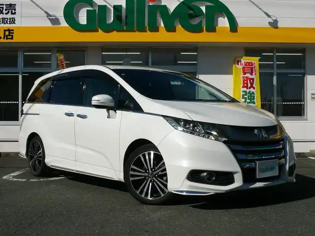 ホンダ オデッセイ アブソルート EX ADV 静岡県 2015(平27)年 6.4万km ホワイトオーキッドパール ワンオーナー/禁煙車/純正インターナビ/フリップダウンモニター/全周囲カメラ/フルセグテレビ/Bluetooth/DVD再生/USB/HDMI/ホンダセンシング/・衝突軽減ブレーキ/・ブラインドスポット/・先行車発進お知らせ/・路外逸脱抑制システム/・標識認識機能/・レーダークルーズ/オートライト/LEDヘッドライト/スマートキー/ETC/新車保証書/取扱説明書