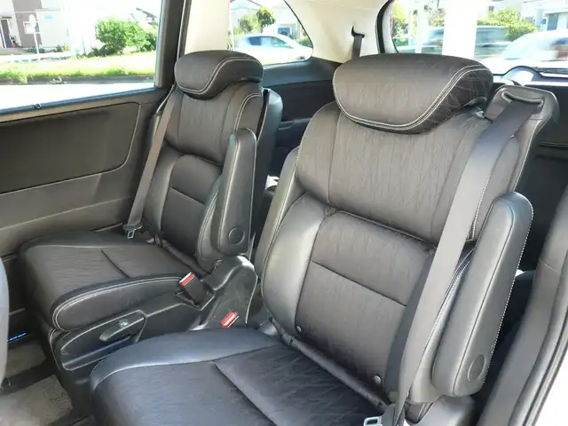 ホンダ オデッセイ アブソルート EX ADV 静岡県 2015(平27)年 6.4万km ホワイトオーキッドパール ワンオーナー/禁煙車/純正インターナビ/フリップダウンモニター/全周囲カメラ/フルセグテレビ/Bluetooth/DVD再生/USB/HDMI/ホンダセンシング/・衝突軽減ブレーキ/・ブラインドスポット/・先行車発進お知らせ/・路外逸脱抑制システム/・標識認識機能/・レーダークルーズ/オートライト/LEDヘッドライト/スマートキー/ETC/新車保証書/取扱説明書