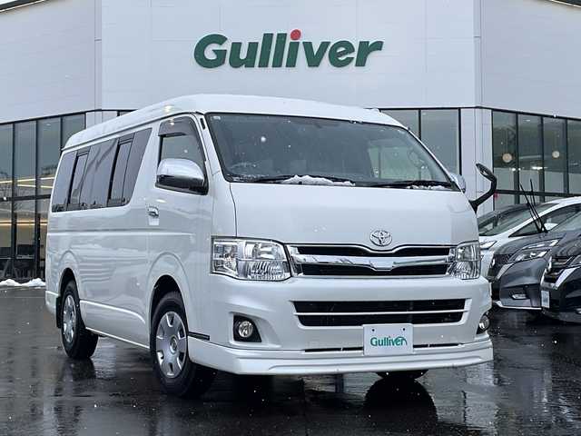 トヨタ ハイエース GL ロング 青森県 2013(平25)年 7.6万km ホワイト ・４WD/・バックカメラ/・片側パワースライドドア/・ETC/・後席取付テレビ(HITACHI L19-H07)/・TRDシートカバー/・電動格納ミラー/・シガーソケット/・100V電源ソケット/・取扱説明書/・保証書