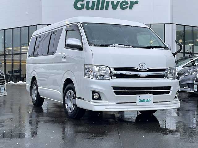 トヨタ ハイエース GL ロング 青森県 2013(平25)年 7.6万km ホワイト ・４WD/・バックカメラ/・片側パワースライドドア/・ETC/・後席取付テレビ(HITACHI L19-H07)/・TRDシートカバー/・電動格納ミラー/・シガーソケット/・100V電源ソケット/・取扱説明書/・保証書