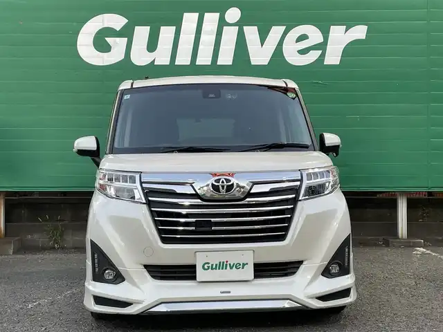 トヨタ ルーミー カスタムG－T 東京都 2017(平29)年 4.9万km パールホワイトⅢ コンフォートパッケージ/・前席シートヒーター/・前席シートバックテーブル/ナビレディパッケージ/・バックカメラ/・ステアリングスイッチ(オーディオ)/モデリスタエアロ　フロント/リアスカート/リアスポイラー/9型メモリナビ(ALPINE　X9V)/社外アンプ　(ALPINE　3553)/ターボ車/クルーズコントロール/スマートアシスト2(衝突回避支援システム)/・衝突回避支援ブレーキ機能/・衝突警報機能/・車線逸脱警報機能/・誤発進抑制制御機能/・先行者発進お知らせ機能/前後方ドライブレコーダー(ZDR015)/両側パワースライドドア/LEDヘッドライト/マルチインフォメーションディスプレイ/スペアキー×1/保証書/取扱説明書