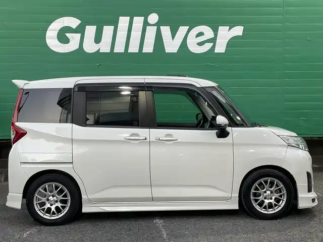 トヨタ ルーミー カスタムG－T 東京都 2017(平29)年 4.9万km パールホワイトⅢ コンフォートパッケージ/・前席シートヒーター/・前席シートバックテーブル/ナビレディパッケージ/・バックカメラ/・ステアリングスイッチ(オーディオ)/モデリスタエアロ　フロント/リアスカート/リアスポイラー/9型メモリナビ(ALPINE　X9V)/社外アンプ　(ALPINE　3553)/ターボ車/クルーズコントロール/スマートアシスト2(衝突回避支援システム)/・衝突回避支援ブレーキ機能/・衝突警報機能/・車線逸脱警報機能/・誤発進抑制制御機能/・先行者発進お知らせ機能/前後方ドライブレコーダー(ZDR015)/両側パワースライドドア/LEDヘッドライト/マルチインフォメーションディスプレイ/スペアキー×1/保証書/取扱説明書