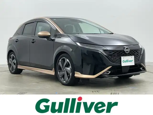 日産 オーラ G レザーエディション 岡山県 2022(令4)年 2.7万km ミッドナイトブラック/サンライズカッパー 純正９インチナビ/【Bluetooth/フルセグTV/Carplay/USB】/ＢＯＳＥプレミアムサウンド/アラウンドビューモニター/デジタルインナーミラー/プロパイロット/前席シートヒーター/ステアリングヒーター/純正ドライブレコーダー（前）/ビルトインＥＴＣ２．０/ＬＥＤヘッドライト/オートハイビーム/フォグランプ/ワイヤレス充電/ＴＶキャンセラー/純正17インチアルミホイール/レザーシート