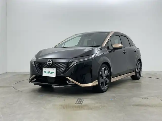 日産 オーラ G レザーエディション 岡山県 2022(令4)年 2.7万km ミッドナイトブラック/サンライズカッパー 純正９インチナビ/【Bluetooth/フルセグTV/Carplay/USB】/ＢＯＳＥプレミアムサウンド/アラウンドビューモニター/デジタルインナーミラー/プロパイロット/前席シートヒーター/ステアリングヒーター/純正ドライブレコーダー（前）/ビルトインＥＴＣ２．０/ＬＥＤヘッドライト/オートハイビーム/フォグランプ/ワイヤレス充電/ＴＶキャンセラー/純正17インチアルミホイール/レザーシート