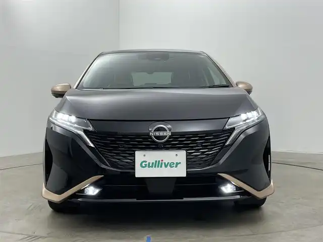 日産 オーラ G レザーエディション 岡山県 2022(令4)年 2.7万km ミッドナイトブラック/サンライズカッパー 純正９インチナビ/【Bluetooth/フルセグTV/Carplay/USB】/ＢＯＳＥプレミアムサウンド/アラウンドビューモニター/デジタルインナーミラー/プロパイロット/前席シートヒーター/ステアリングヒーター/純正ドライブレコーダー（前）/ビルトインＥＴＣ２．０/ＬＥＤヘッドライト/オートハイビーム/フォグランプ/ワイヤレス充電/ＴＶキャンセラー/純正17インチアルミホイール/レザーシート