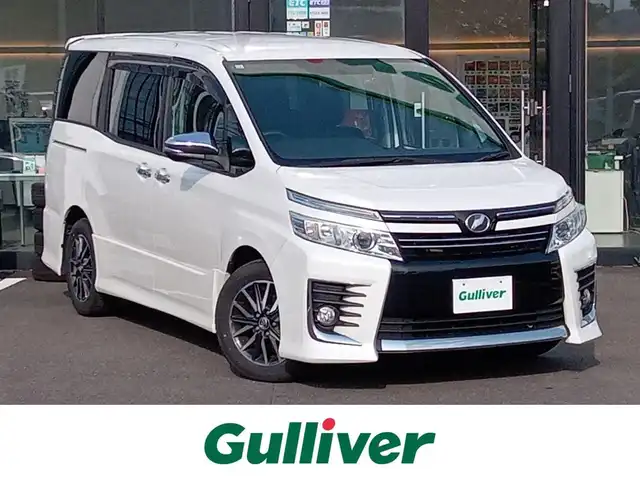 トヨタ ヴォクシー ZS 煌 福井県 2015(平27)年 11万km ホワイトパールクリスタルシャイン 9インチナビ（ALPINE X9）/・（フルセグTV/CD/DVD/Bluetooth）/バックカメラ/ドライブレコーダー/ビルトインETC/ステアリングスイッチ/オートLEDライト/電動格納ウィンカーミラー/両側パワースライドドア/純正16インチAW/スマートキー