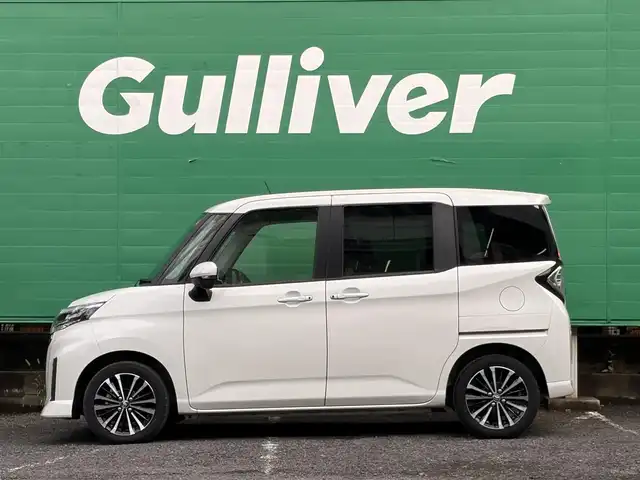 トヨタ ルーミー カスタムG－T 東京都 2022(令4)年 2万km パールホワイトⅢ ワンオーナー/禁煙車/パノラミックビュー対応ナビレディパッケージ/・パノラミックビューモニター/・ステアリングスイッチ/スマートアシスト/・衝突回避支援ブレーキ機能/・車線逸脱警報機能/・ブレーキ制御付き誤発進抑制機能/・アダプティブドライビングビーム/・アダプティブクルーズコントロール/・コーナーセンサー/・サイドビューランプ/両側パワースライドドア/LEDヘッドランプ/オートライト/スマートキー/カーテンエアバッグ/フロアマット/保証書/取扱説明書/スペアキー