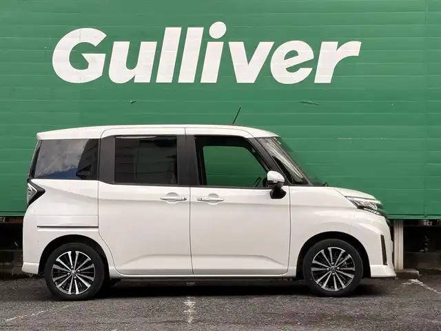 トヨタ ルーミー カスタムG－T 東京都 2022(令4)年 2万km パールホワイトⅢ ワンオーナー/禁煙車/パノラミックビュー対応ナビレディパッケージ/・パノラミックビューモニター/・ステアリングスイッチ/スマートアシスト/・衝突回避支援ブレーキ機能/・車線逸脱警報機能/・ブレーキ制御付き誤発進抑制機能/・アダプティブドライビングビーム/・アダプティブクルーズコントロール/・コーナーセンサー/・サイドビューランプ/両側パワースライドドア/LEDヘッドランプ/オートライト/スマートキー/カーテンエアバッグ/フロアマット/保証書/取扱説明書/スペアキー