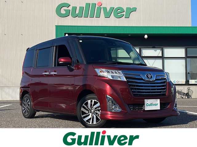 トヨタ ルーミー カスタムG 島根県 2020(令2)年 2万km ブラックマイカメタリック/ファイアークォーツレッドメタリック 純正9インチSDナビゲーション(NSZT-Y68T)/フルセグ BT SD CD DVD/全方位カメラ/サイドカメラ/レーンキープアシスト/クルーズコントロール/両側パワースライドドア/D/N席シートヒーター/オートマチックハイビーム/LEDヘッドライト/AUTOライト/フォグライト/後席サイドサンシェード/オートリトラミラー/ISOFIX/革巻きステアリング/ステアリングリモコン/純正14インチアルミホイール