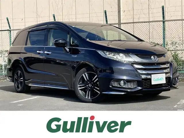 ホンダ オデッセイ ハイブリッド アブソルートセンシングEXパック 東京都 2016(平28)年 6万km プレミアムヴィーナスブラックP 純正ナビ/純正フリップダウンモニター/FM/AM/DVD/CD/マルチビューカメラシステム/フルセグTV/ETC/衝突軽減ブレーキ装置/両側電動スライドドア/ハーフレザー/レーンアシスト/LEDヘッドライト