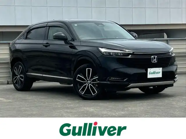ホンダ ヴェゼル ハイブリッド e:HEV Z 静岡県 2022(令4)年 3.8万km クリスタルブラックパール 禁煙車/純正メモリナビ/AM/FM/USB/BT/前後ドライブレコーダー/ハーフレザーシート/革巻きステアリング/ステアリングスイッチ/前席シートヒーター/ステアリングヒーター/電動リアゲート/ビルトインETC/ホンダセンシング/路外逸脱抑制/レーンキープアシスト/ブラインドスポットインフォメーション/踏み間違い衝突軽減/CMBS/ACC/パーキングセンサー/ヒルディセントコントロール/電動パーキング/ブレーキホールド/LEDオートライト/フロントフォグ/オートハイビーム/純正フロアマット/純正ドアバイザー/保証書取扱説明書スペアキー