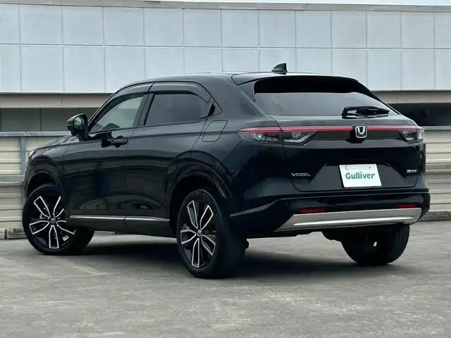 ホンダ ヴェゼル ハイブリッド e:HEV Z 静岡県 2022(令4)年 3.8万km クリスタルブラックパール 禁煙車/純正メモリナビ/AM/FM/USB/BT/前後ドライブレコーダー/ハーフレザーシート/革巻きステアリング/ステアリングスイッチ/前席シートヒーター/ステアリングヒーター/電動リアゲート/ビルトインETC/ホンダセンシング/路外逸脱抑制/レーンキープアシスト/ブラインドスポットインフォメーション/踏み間違い衝突軽減/CMBS/ACC/パーキングセンサー/ヒルディセントコントロール/電動パーキング/ブレーキホールド/LEDオートライト/フロントフォグ/オートハイビーム/純正フロアマット/純正ドアバイザー/保証書取扱説明書スペアキー