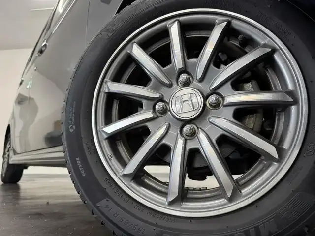 ホンダ Ｎ ＷＧＮ カスタム G ターボパッケージ 三重県 2014(平26)年 1.3万km ポリッシュドメタルメタリック ガソリン・ターボ/FF/MTモード付インパネCVT/純正 7インチナビ VXM-145C/（FM/AM/CD/USB/iPod/SD/VTR/AUX）/バックカメラ/安全/・近距離衝突軽減ブレーキ［CTBA］/・VSA（ABS＋TCS＋横すべり抑制）/・SRS サイド＆カーテンエアバッグ/装備/・ハーフレザーシート/・クルーズコントロール/・パドルシフト/・オートエアコン/・オートライト/・キセノンヘッドライト/・フロントフォグランプ/・ステアリングスイッチ/・電動格納ドアミラー（ウインカー付）/・純正14inAW/・プッシュスタート/・スマートキーx2/・本革巻きステアリング/・リアシートベルトインジケータ付きインナーミラー/など