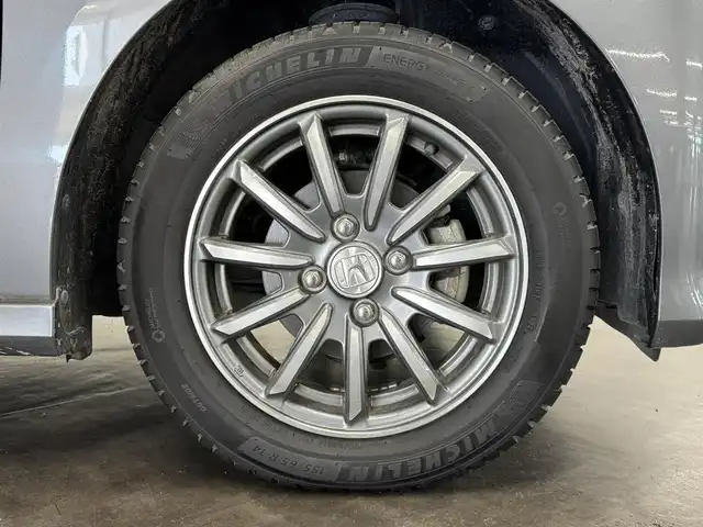 ホンダ Ｎ ＷＧＮ カスタム G ターボパッケージ 三重県 2014(平26)年 1.3万km ポリッシュドメタルメタリック ガソリン・ターボ/FF/MTモード付インパネCVT/純正 7インチナビ VXM-145C/（FM/AM/CD/USB/iPod/SD/VTR/AUX）/バックカメラ/安全/・近距離衝突軽減ブレーキ［CTBA］/・VSA（ABS＋TCS＋横すべり抑制）/・SRS サイド＆カーテンエアバッグ/装備/・ハーフレザーシート/・クルーズコントロール/・パドルシフト/・オートエアコン/・オートライト/・キセノンヘッドライト/・フロントフォグランプ/・ステアリングスイッチ/・電動格納ドアミラー（ウインカー付）/・純正14inAW/・プッシュスタート/・スマートキーx2/・本革巻きステアリング/・リアシートベルトインジケータ付きインナーミラー/など