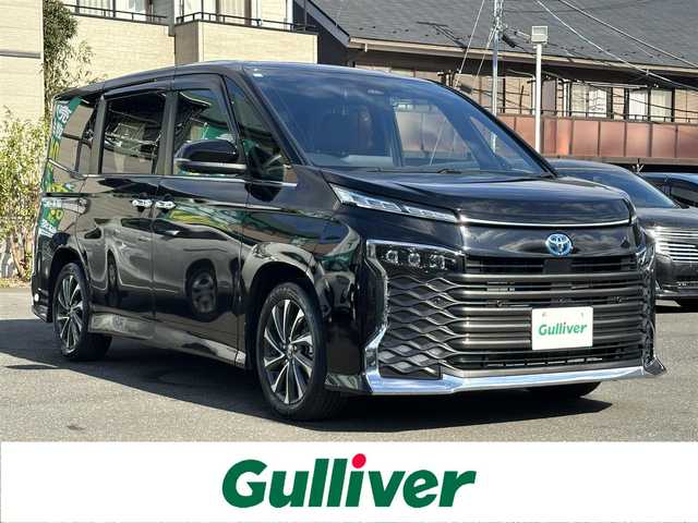 トヨタ ヴォクシー ハイブリッド S－Z 東京都 2023(令5)年 2.8万km 黒 ナビゲーション　/フルセグテレビ　/ＣＤ＆ＤＶＤ　/ブルートゥース　/ＵＳＢ接続　/全方位カメラ　/ハーフレザーシート/シートヒーター/コーナーセンサー/ドライブレコーダー/衝突軽減ブレーキ　/車線逸脱警報　/アダプティブクルーズ　/両側パワースライドドア　/保証書　/取扱説明書　/整備手帳