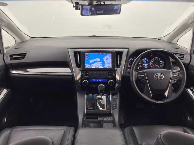 トヨタ ヴェルファイア Z Gエディション 宮崎県 2015(平27)年 6.2万km ホワイトパールクリスタルシャイン 禁煙車/プリクラッシュセーフティシステム/純正10.5型ディスプレイオーディオ/（AUX/HDMI/Bluetooth/FMAM/フルセグTV/ナビ）/純正13.3型リアフリップダウンモニター/純正JBLサウンドシステム/純正ビルトインDSRC ETC/純正キセノンオートライト/純正フォグ/純正18インチアルミ/純正フロアマット/アダプティブクルーズコントロール/黒本革シート/前席パワーシート/シートヒーター/エグゼクティブパワーシート/ウッドコンビ本革巻ハンドル/マホガニーウッドパネル/パワーバックドア/スマートキー/プッシュエンジンスタート/新車時保証書/取扱い説明書