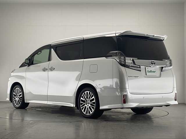 トヨタ ヴェルファイア Z Gエディション 宮崎県 2015(平27)年 6.2万km ホワイトパールクリスタルシャイン 禁煙車/プリクラッシュセーフティシステム/純正10.5型ディスプレイオーディオ/（AUX/HDMI/Bluetooth/FMAM/フルセグTV/ナビ）/純正13.3型リアフリップダウンモニター/純正JBLサウンドシステム/純正ビルトインDSRC ETC/純正キセノンオートライト/純正フォグ/純正18インチアルミ/純正フロアマット/アダプティブクルーズコントロール/黒本革シート/前席パワーシート/シートヒーター/エグゼクティブパワーシート/ウッドコンビ本革巻ハンドル/マホガニーウッドパネル/パワーバックドア/スマートキー/プッシュエンジンスタート/新車時保証書/取扱い説明書