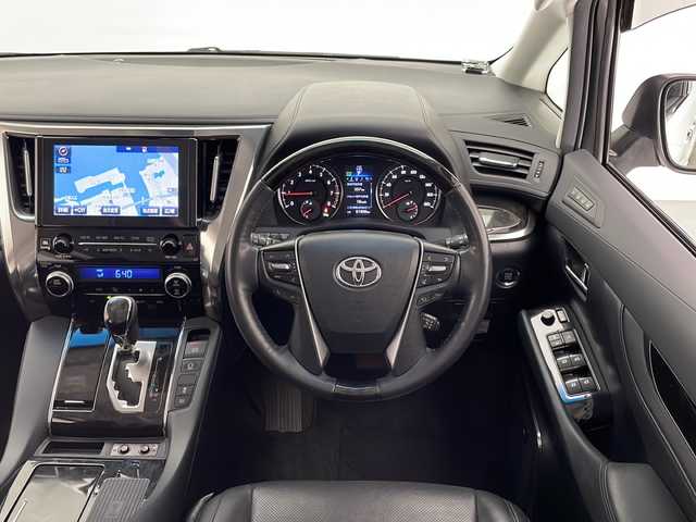 トヨタ ヴェルファイア Z Gエディション 宮崎県 2015(平27)年 6.2万km ホワイトパールクリスタルシャイン 禁煙車/プリクラッシュセーフティシステム/純正10.5型ディスプレイオーディオ/（AUX/HDMI/Bluetooth/FMAM/フルセグTV/ナビ）/純正13.3型リアフリップダウンモニター/純正JBLサウンドシステム/純正ビルトインDSRC ETC/純正キセノンオートライト/純正フォグ/純正18インチアルミ/純正フロアマット/アダプティブクルーズコントロール/黒本革シート/前席パワーシート/シートヒーター/エグゼクティブパワーシート/ウッドコンビ本革巻ハンドル/マホガニーウッドパネル/パワーバックドア/スマートキー/プッシュエンジンスタート/新車時保証書/取扱い説明書