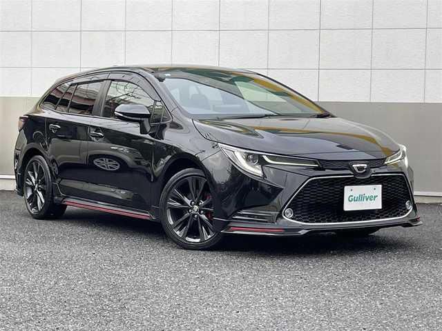 トヨタ カローラツーリング ダブルバイビー 東京都 2021(令3)年 1.8万km ブラックマイカ TRDフルエアロ/TRDドアハンドルプロテクター/モデリスタスカッフプレート/純正9インチディスプレイオーディオナビ/　DVD/CD/Bluetooth/バックカメラ/プリクラッシュセーフティ/レーンディパーチャーアラート/レーダークルーズコントロール/オートマチックハイビーム/クリアランスソナー/LEDヘッドライト/LEDデイライト/純正17インチアルミホイール/ハーフレザーシート/前後ドライブレコーダー/ビルトインETC/ステアリングスイッチ/革巻きステアリングホイール/電動オート格納ミラー/ウインカーミラー/プッシュスタート/スマートキー/スペアキー/ヘッドライトレベライザー/横すべり防止/保証書/取扱説明書