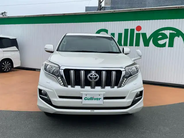 トヨタ ランドクルーザー プラド TX Lパッケージ 三重県 2016(平28)年 7.6万km ホワイトパールクリスタルシャイン ワンオーナー/BIGXメモリナビ/フルセグテレビ/バックカメラ/モデリスタフロントエアロ/サンルーフ/黒革シート/シートヒーター