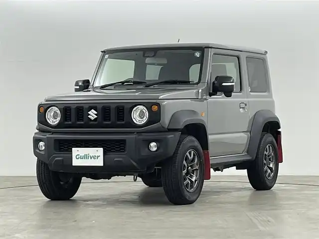 スズキ ジムニー シエラ JC 福島県 2021(令3)年 2.3万km ミディアムグレー 純正ディスプレイオーディオ/型式：PVH-9300DVSZS/【AM/FM/CD/DVD/USB/Bluetooth/AppleCarPlay/AndroidAuto】/・純正ETC/衝突軽減ブレーキ/車線逸脱警報装置/クルーズコントロール/オートマチックハイビーム/ダウンヒルアシスト/4WD/ヘッドライトウォッシャー/ステアリングスイッチ/運転席＋助手席シートヒーター/背面タイヤ/(195/80/R15) 山10mm/LEDヘッドライト/・オートライト/・フロントフォグライト/マッドフラップ/純正15インチアルミホイール/電動格納ウィンカーミラー/・オートミラー/盗難防止装置/プッシュスタート/・スマートキー/・スペアキー/取扱説明書/・保証書