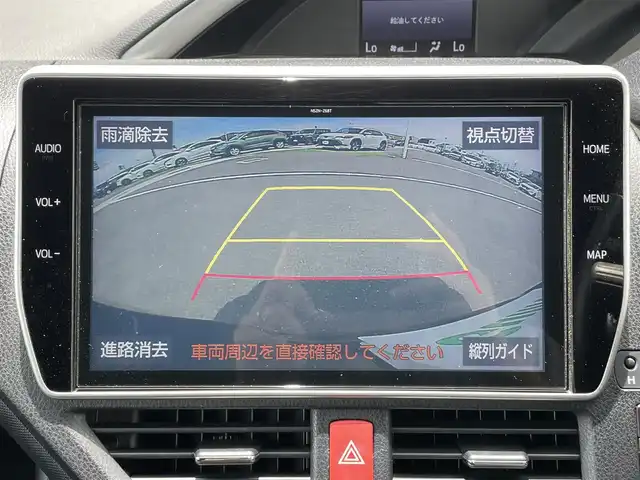 トヨタ ヴォクシー ハイブリッド ZS 煌Ⅱ 香川県 2019(平31)年 2.5万km イナズマスパーキングブラックガラスフレーク 登録時走行距離：24326km/バックカメラ/前方ドライブレコーダー/革巻きステアリング/ステアリングリモコン/クルーズコントロール/前席シートヒーター/ビルトインETC/LEDオートライト/オートハイビーム/電格ウィンカーミラー/両側パワースライド/USB充電/純正16インチアルミホイール/純正マット/スペアキー1本/後部座席サンシェイド/プリクラッシュセーフティー/パーキングサポートブレーキ/スペアキー1本