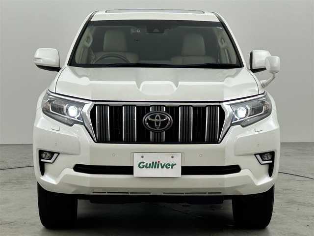 トヨタ ランドクルーザー プラド TX Lパッケージ 福岡県 2021(令3)年 9.4万km ホワイトパールクリスタルシャイン サンルーフ　/純正９型ナビ　/バックカメラ　/ビルトインＥＴＣ２．０　/前後ドラレコ　/レーダークルコン　/トヨタセーフティセンス/衝突軽減ブレーキ/レーンキープ/ヒルディセントコントロール/センターデフロック/本革シート/シートベンチレーション／ヒーター　/パワーシート/ＭＴモード付　/純正１９インチＡＷ/LEDヘッドライト