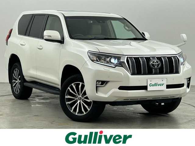 トヨタ ランドクルーザー プラド TX Lパッケージ 福岡県 2021(令3)年 9.4万km ホワイトパールクリスタルシャイン サンルーフ　/純正９型ナビ　/バックカメラ　/ビルトインＥＴＣ２．０　/前後ドラレコ　/レーダークルコン　/トヨタセーフティセンス/衝突軽減ブレーキ/レーンキープ/ヒルディセントコントロール/センターデフロック/本革シート/シートベンチレーション／ヒーター　/パワーシート/ＭＴモード付　/純正１９インチＡＷ/LEDヘッドライト