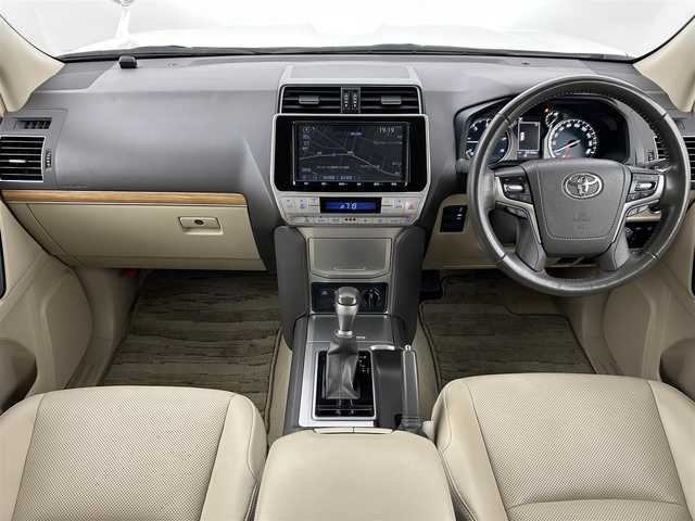トヨタ ランドクルーザー プラド TX Lパッケージ 福岡県 2021(令3)年 9.4万km ホワイトパールクリスタルシャイン サンルーフ　/純正９型ナビ　/バックカメラ　/ビルトインＥＴＣ２．０　/前後ドラレコ　/レーダークルコン　/トヨタセーフティセンス/衝突軽減ブレーキ/レーンキープ/ヒルディセントコントロール/センターデフロック/本革シート/シートベンチレーション／ヒーター　/パワーシート/ＭＴモード付　/純正１９インチＡＷ/LEDヘッドライト