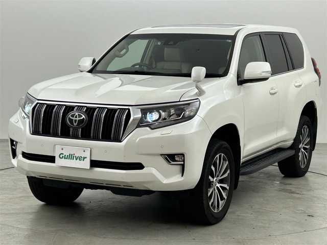 トヨタ ランドクルーザー プラド TX Lパッケージ 福岡県 2021(令3)年 9.4万km ホワイトパールクリスタルシャイン サンルーフ　/純正９型ナビ　/バックカメラ　/ビルトインＥＴＣ２．０　/前後ドラレコ　/レーダークルコン　/トヨタセーフティセンス/衝突軽減ブレーキ/レーンキープ/ヒルディセントコントロール/センターデフロック/本革シート/シートベンチレーション／ヒーター　/パワーシート/ＭＴモード付　/純正１９インチＡＷ/LEDヘッドライト