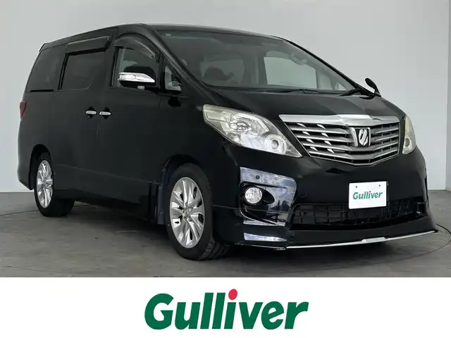 トヨタ アルファード 240S 大分県 2009(平21)年 8.7万km ブラック 純正HDDナビ/（フルセグ/CD/DVD/Bluetooth）/フリップダウンモニター/バックカメラ/黒革調シートカバー/両側パワースライドドア/ステアリングスイッチ/スマートキープッシュスタート/電動格納ミラー/オートライト/純正アルミホイール