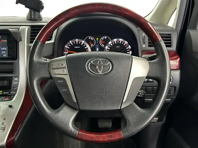 トヨタ アルファード 240S 大分県 2009(平21)年 8.7万km ブラック 純正HDDナビ/（フルセグ/CD/DVD/Bluetooth）/フリップダウンモニター/バックカメラ/黒革調シートカバー/両側パワースライドドア/ステアリングスイッチ/スマートキープッシュスタート/電動格納ミラー/オートライト/純正アルミホイール