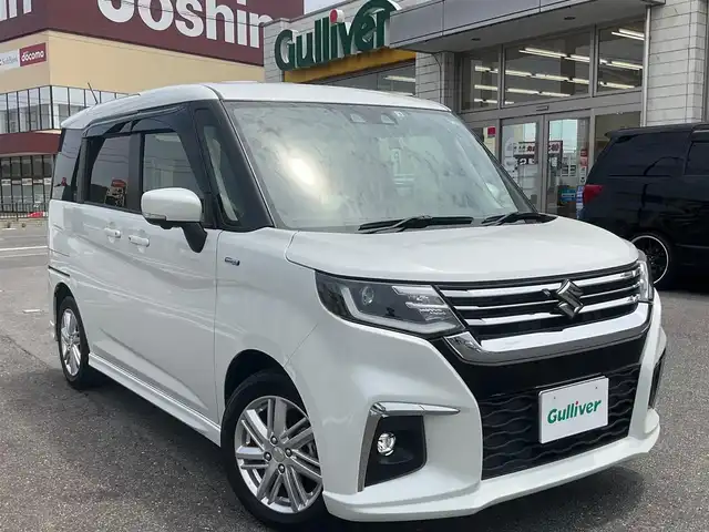 スズキ ソリオ HV MZ 滋賀県 2022(令4)年 3.6万km ピュアホワイトP 全方位モニター付ナビ装着車/ワンオーナー /純正15インチアルミホイール/両側パワースライドドア/純正メーカーOP9インチナビゲーション/・CD/DVD/・AM/FM/・Bluetooth/全方位モニター/純正ETC/ヘッドアップディスプレイ/前後ドライブレコーダー/前席シートヒーター/クルーズコントロール/スペアキー/取扱説明書/保証書/