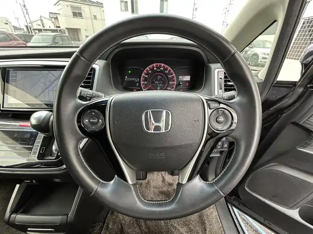 ホンダ オデッセイ アブソルート 三重県 2014(平26)年 9.9万km プレミアムヴィーナスブラックP 登録時98178km/ディーラーナビ（フルセグＴＶ／ＦＭ／ＡＭ／ＣＤ／ＤＶＤ／ＵＳＢ／ＨＤＭＩ）/両側パワースライドドア/ビルドインETC/クルーズコントロール/パドルシフト/バックカメラ/フルフラットシート/後部席モニター/ハーフレザー(黒)/AUTOライト/純正フロアマット/ステアリングスイッチ/革巻ステアリング/電格ミラー/三列シート/ウォークスルー/フォグランプ/ドアバイザー