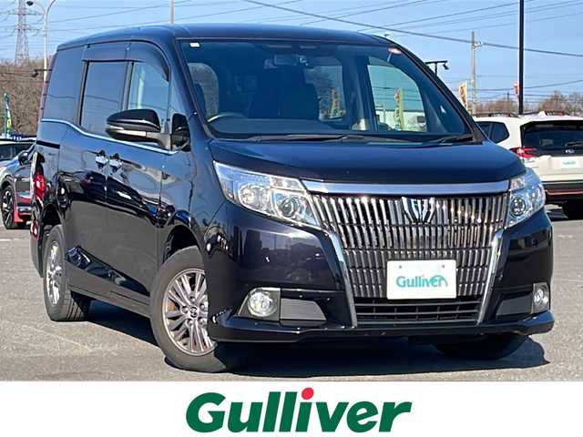 トヨタ エスクァイア Gi 道央・札幌 2015(平27)年 8.8万km スパークリングブラックパールクリスタルシャイン ４WD/寒冷地仕様/純正ディーラーOPナビ/CD/DVD/BT/フルセグ/純正フリップダウンモニター/横滑り防止装置/クルーズコントロール/バックカメラ/ビルトインETC/アイドリングストップ/ECOMODE/自動防眩ミラー/両側パワースライドドア/前席シートヒーター/レザーシート/革巻きウッドコンビステアリング/ステアリングリモコン/MTモード付AT/プッシュスタート/スマートキー/LEDヘッドライト/オートライト/オートハイビーム/フォグランプ/電動格納ミラー/ウィンカーミラー/純正フロアマット/ドアバイザー/スペアキー/純正エンジンスターター/純正AW付冬タイヤ積込/195/65/R15/2019年/山5mm/社外アルミホイール積込（４本）