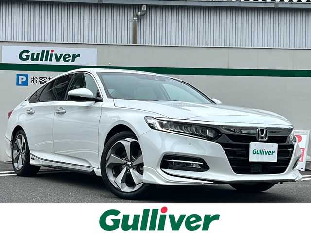ホンダ アコード EX 東京都 2021(令3)年 0.2万km プラチナホワイトパール Honda SENSING/・衝突軽減ブレーキ/・誤発進抑制機能/・後方誤発進抑制機能/・近距離衝突軽減ブレーキ/・歩行者事故低減ステアリング/・路外逸脱抑制機能/・アダプティブクルーズコントロール/・車線維持支援システム/・トラフィックジャムアシスト/・先行車発進お知らせ機能/・標識認識機能/・オートハイビーム/・アダプティブドライビングビーム/・パーキングセンサーシステム/・急アクセル抑制機能/・ブラインドスポットインフォメーション/・後退出庫サポート/・Honda パーキングパイロット/・ドライバー注意力モニター/ヘッドアップディスプレー/サンルーフ/Hondaインターナビ/・ワンセグTV/Bluetooth/apple car play/android auto/前後ドライブレコーダー（ZDR‐025）/moduloエアロ/シートヒーター/オートエアコン/ワイヤレス充電器/取扱説明書/保証書